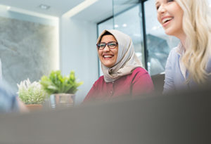 Business Women Smiling in a Meeting