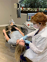 Green Orthodontics - Dentist Chair With Patient